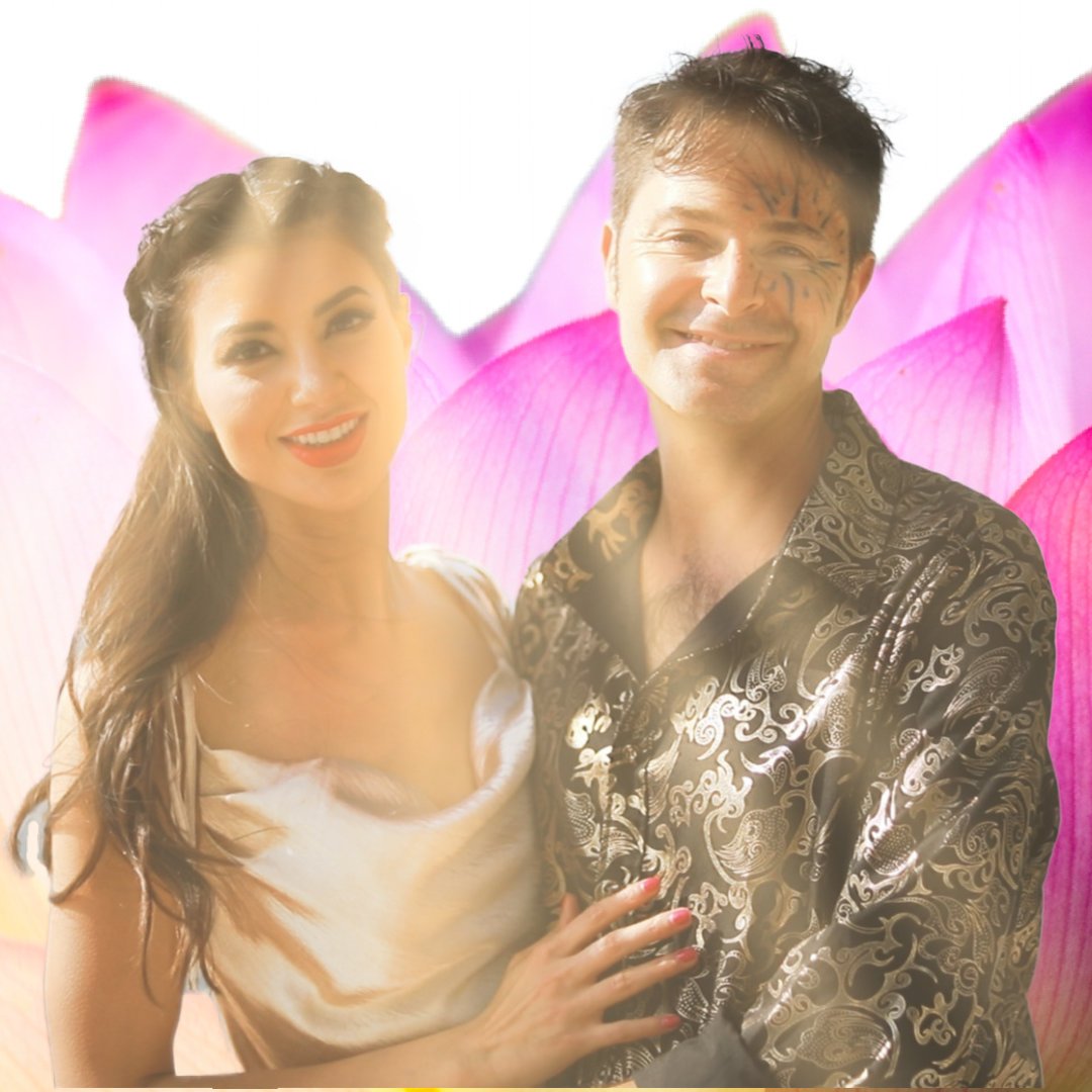 Max and Jasmine by water with lotus